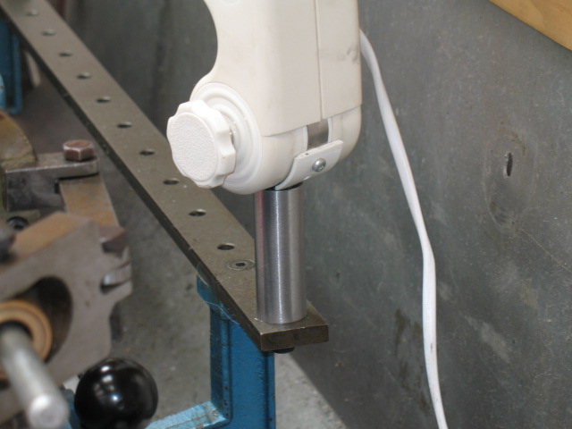The support bolts straight onto the taper turning bar. The hole is perfectly located to support a lamp.