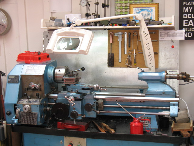 The magnifying lamp provides shadowless light and is easily swung out of the way.